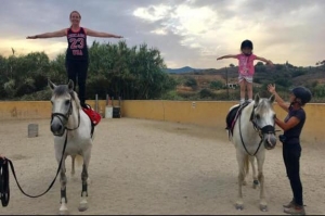 mum and daughter horse riding