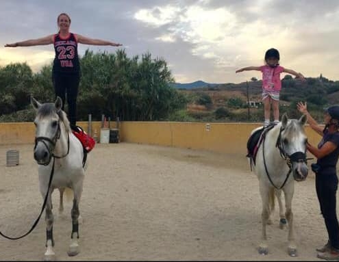 mum and daughter horse riding