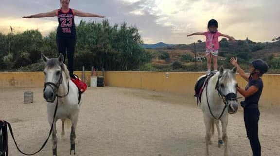 mum and daughter horse riding