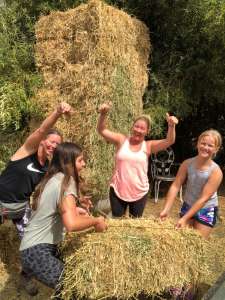 Hay helpers - moiving hay at Ranch Siesta Los Rubios Estepona before the rain