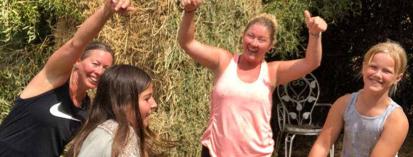 Hay helpers - moiving hay at Ranch Siesta Los Rubios Estepona before the rain